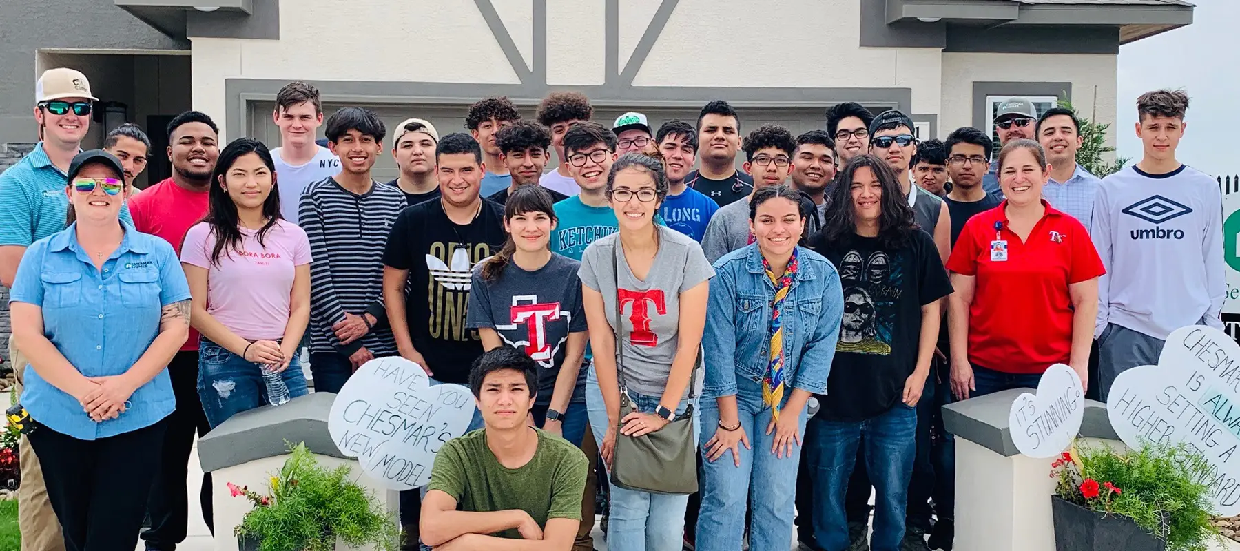 Chesmar employees smiling in group photo